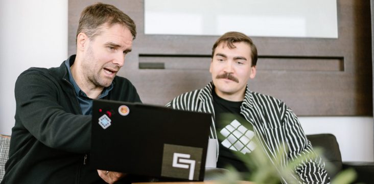 Two Sofokus experts looking at AI glossary