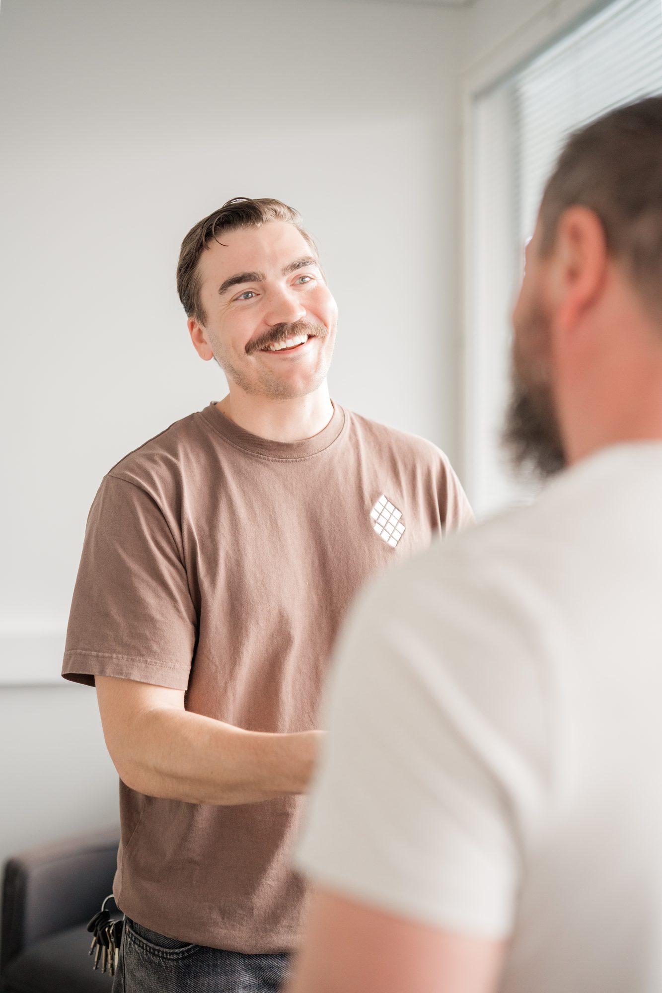 mustache person handshake smiling