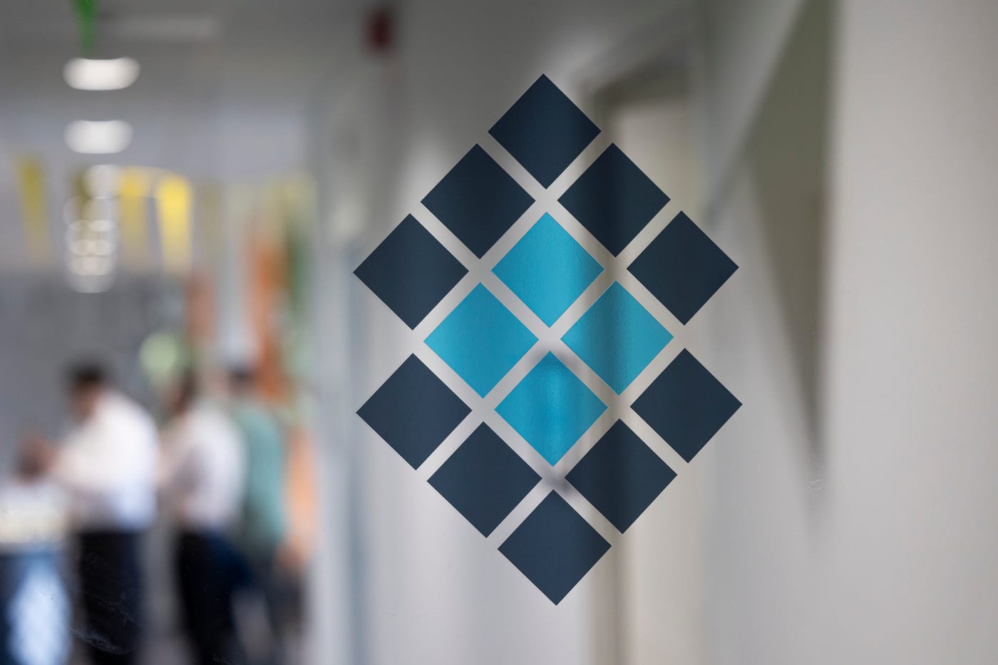 The Sofokus brand pattern on a glass wall at the Sofokus office