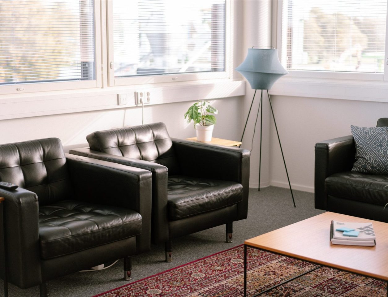 An empty lounge area with sunlight coming through the window blinds – Integrations