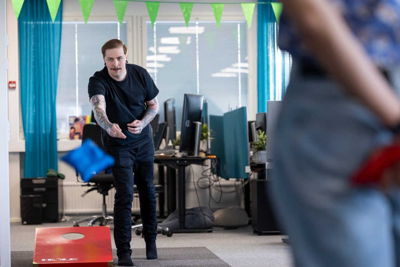 Sofokus developer tossing a beanbag during a break at the Turku office