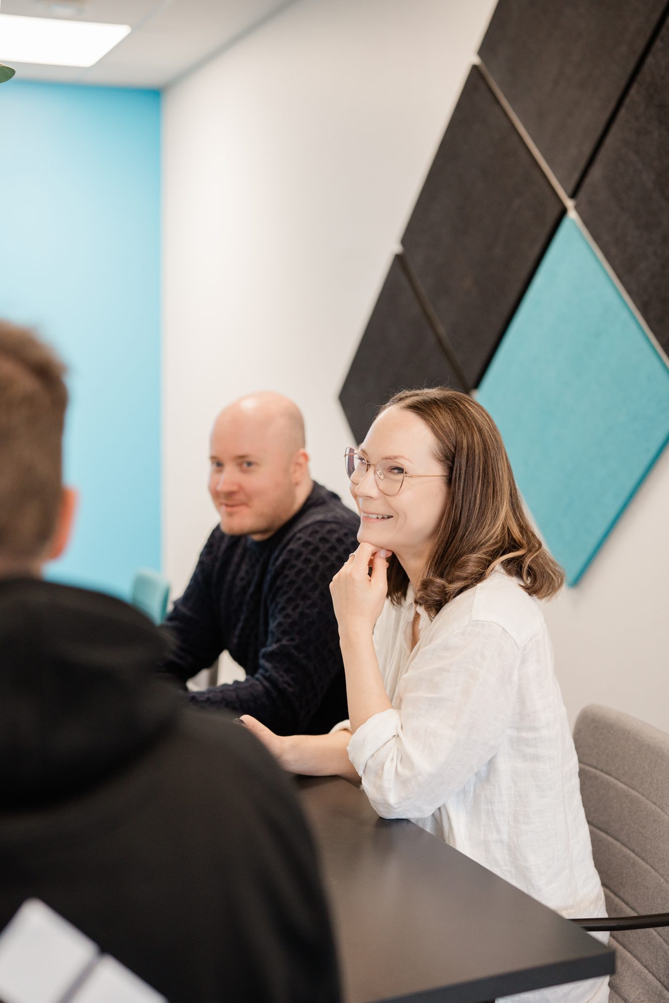 two people meeting black teal pattern